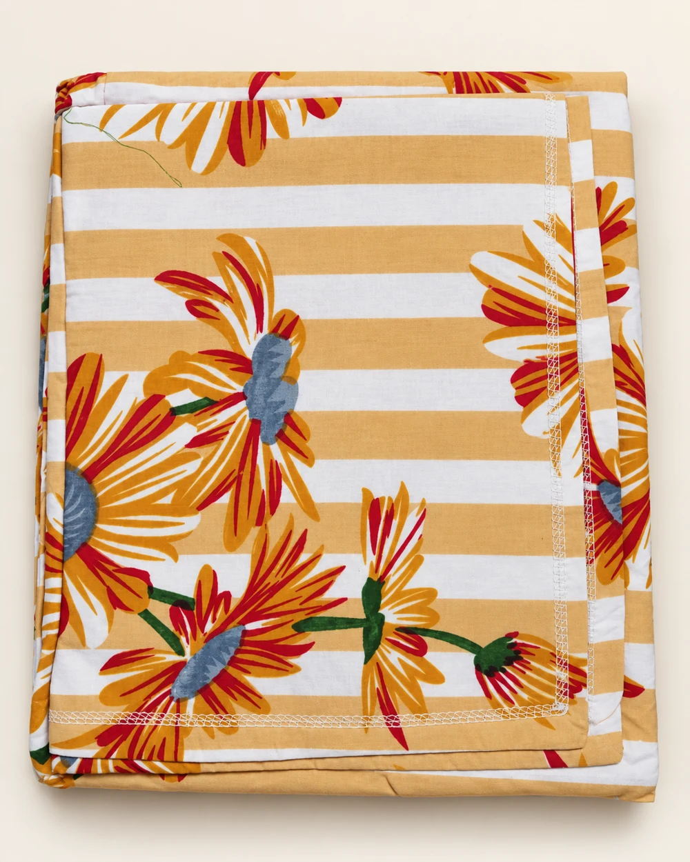 Golden Daisy printed bedsheet, folded to show its design